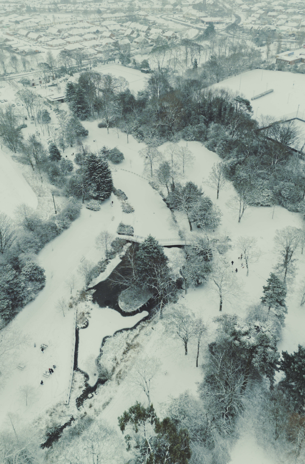 Aerial drone view of snowy countryside roads