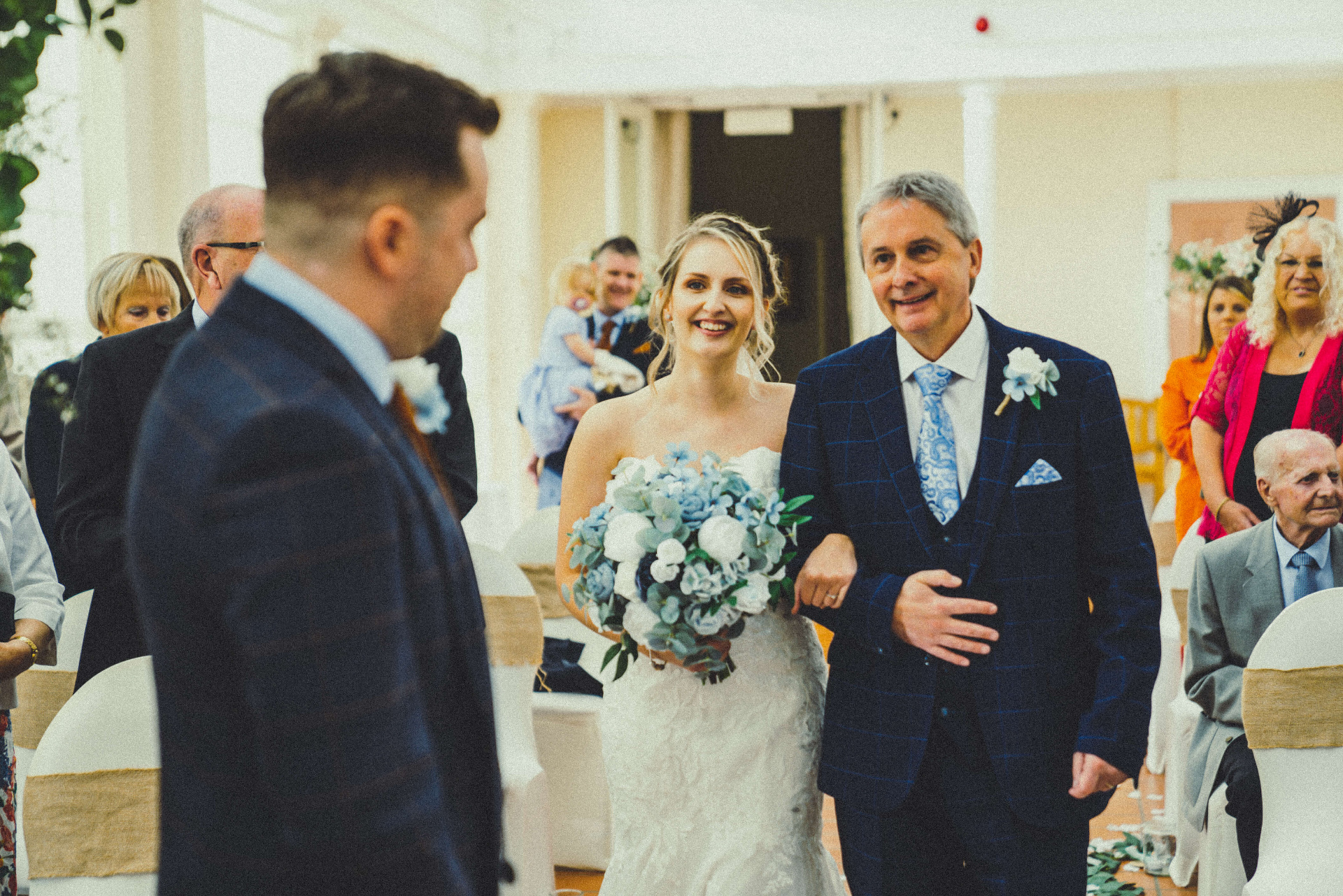 Bride walking down the aisle with her bouquet